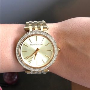 Michael Kors Gold watch with diamond ring.